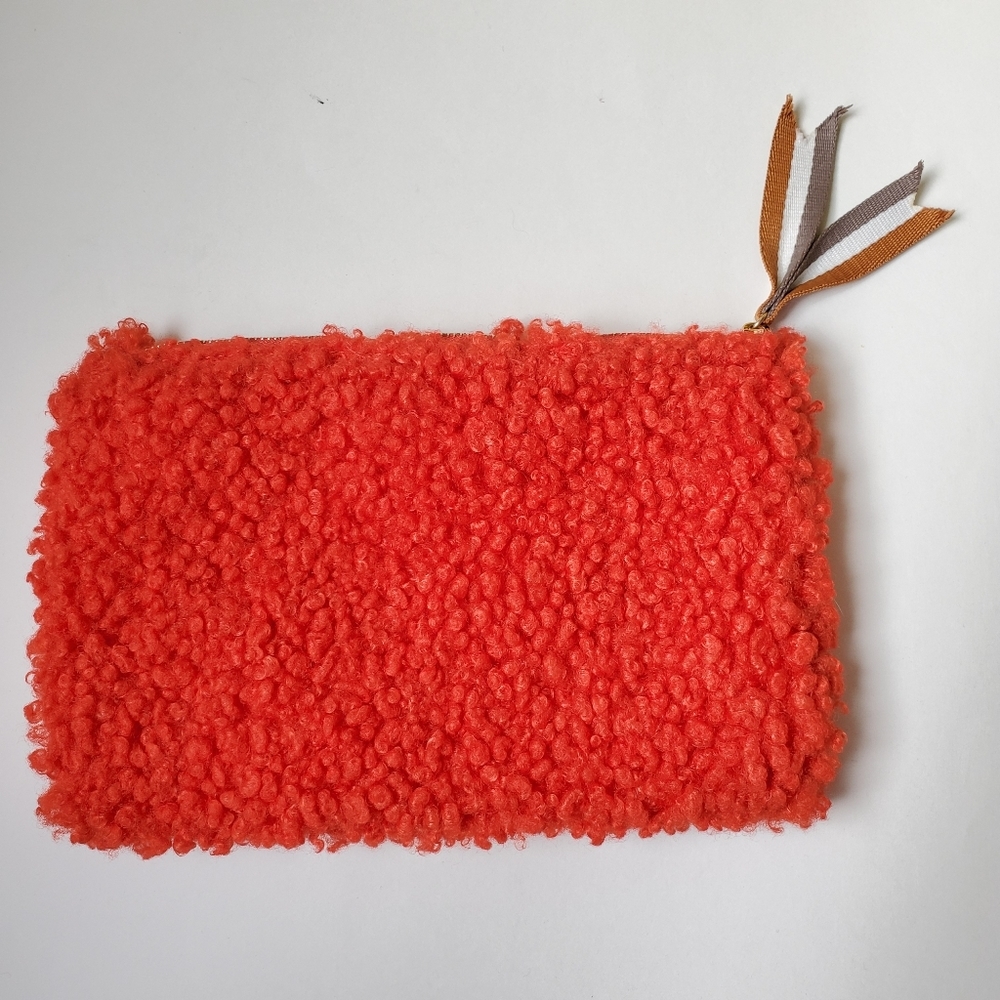 Urban Outfitters red faux sheep wool makeup pouch